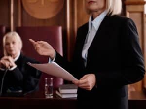 A female personal injury attorney presenting her case in front of a judge.